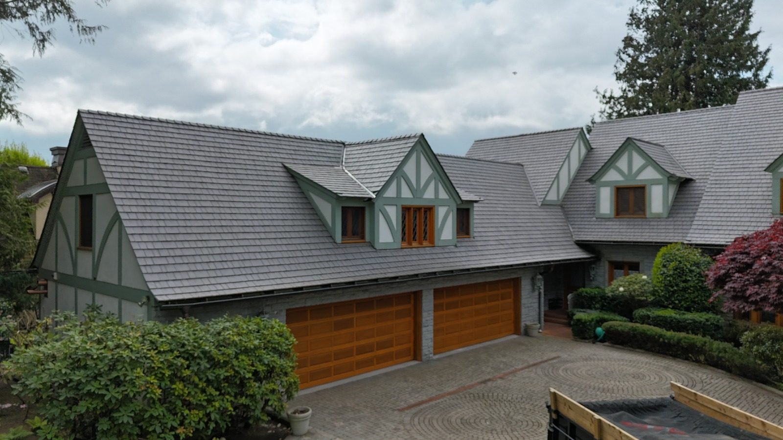 Finished composite shake roof on a Tudor-style home in the Lower Mainland